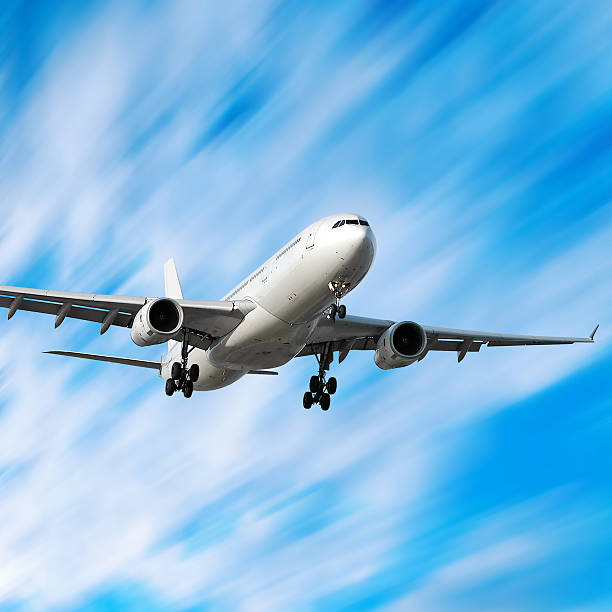 istock jet airplane landing in motion blur sky 136884685