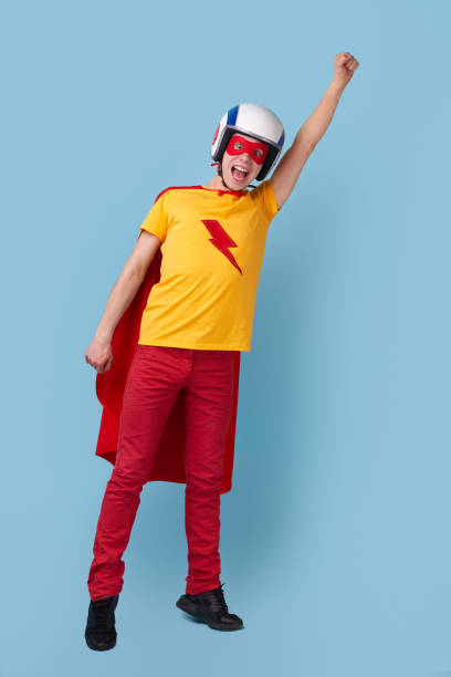 istock Funny superhero pretending to fly 1368847843