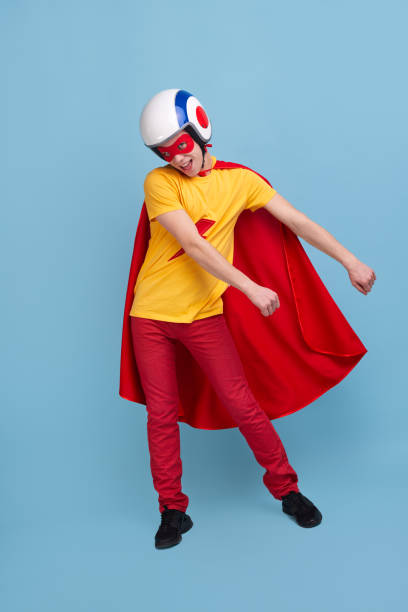 Funny superhero dancing and smiling