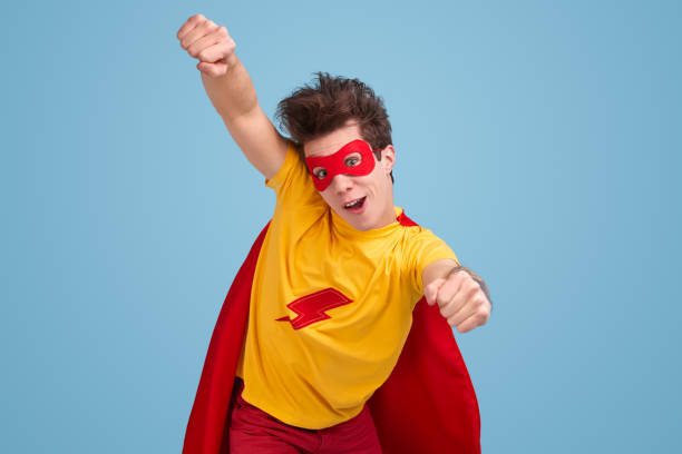 istock Funny superhero man flying in studio 1368847861