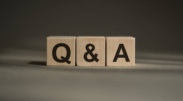 istock Q&A - question and answer form on a wooden block on a gray background. 1368848148