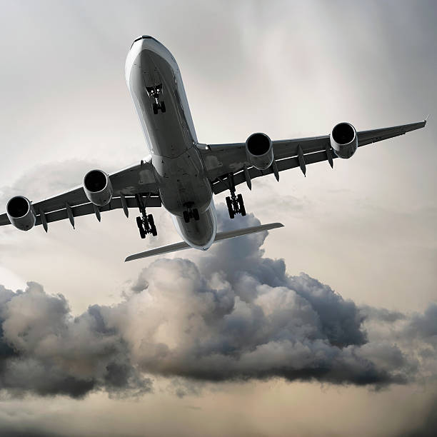 istock jet airplane landing in storm 136885280