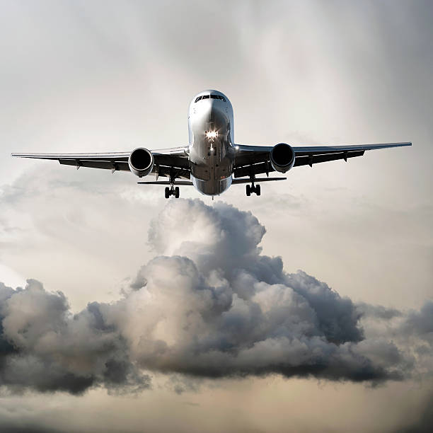istock jet airplane landing in storm 136886091