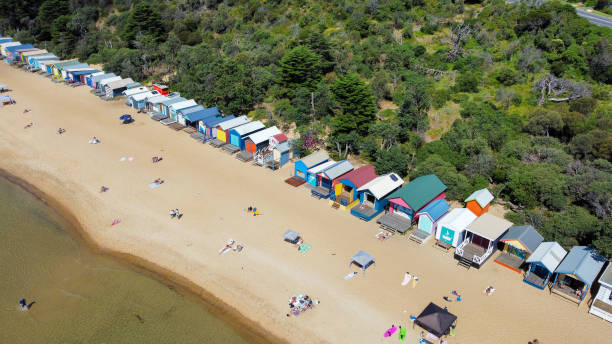 Mornington - Beach Boxes at Mills Beach Mornington peninsula - Aerial Drone view The bathing or beach boxes at mills beach in Mornington on the beautiful Mornington peninsula coast. Stunning Australian coastline in Victoria. Aerial Drone photograph shot with a dji mini2. People swimming and enjoying the beach in Summer. Calm water. Victoria Bay stock pictures, royalty-free photos & images