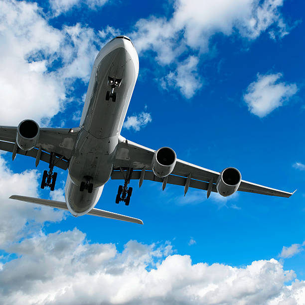 istock jet airplane landing in bright sky 136886286