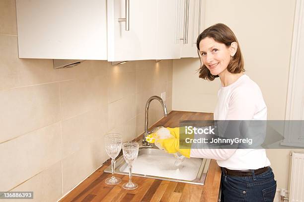 Smiling Woman Washing Up Stock Photo - Download Image Now - Mature Women, Washing Dishes, 40-44 Years