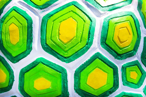 Colorful concrete wall texture with embossed tortoise shell pattern green yellow white background