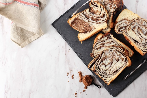 Cinnamon Babka or Brioche Bread. Swirl Bread, Homemade Pastry for Breakfast, White Background, Selected Focus