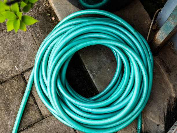 istock Tosca colored water hose rolled up 1368873260