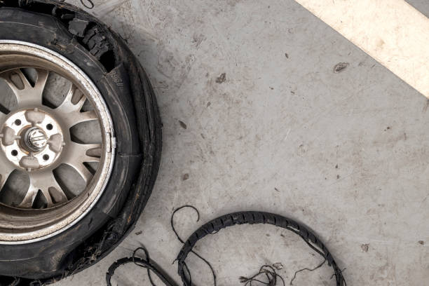 istock car tire cracked on cement floor in garage. top view. flat lay 1368873826