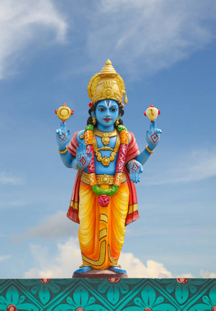 Hindu god Perumal statue on temple tower stock photo