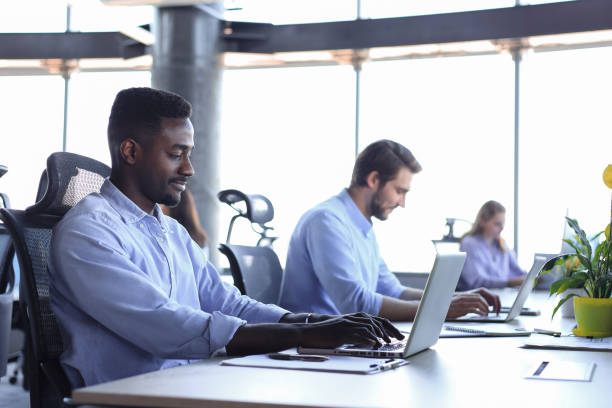 istock Modern business men analyzing stock market data while working in the office. 1368883777