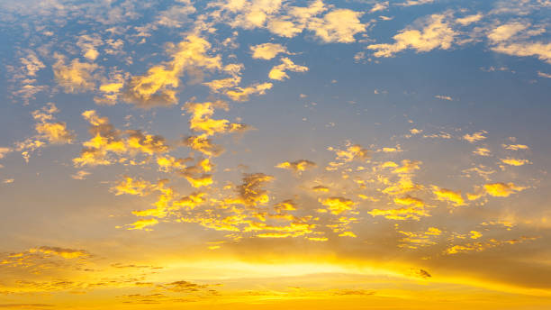 istock sky and fluffy clouds with sunlight at skyline, panoramic nature background 1368887418