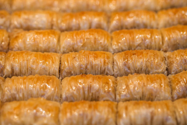 istock Baklava honey sweet cut into pieces, syrup-soaked layer cake, selective focus. 1368893580