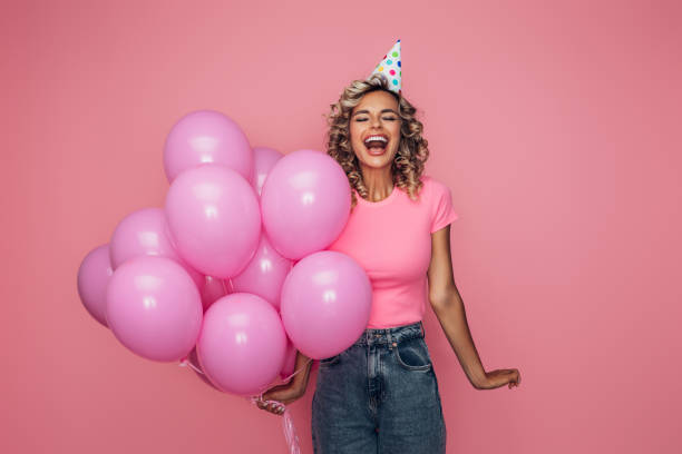 istock Happy beautiful woman with balloons 1368893697