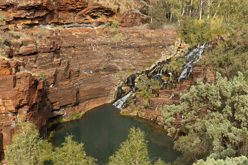 a high angle wide view of fortescue falls at karijini national park in the pilbara region of western australia