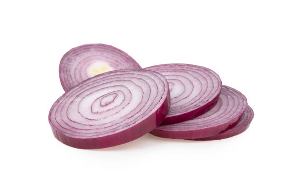 istock Red sliced onion isolated on white background 1368894578