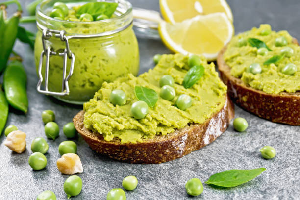 istock Sandwich green pea hummus on the table 1368899317