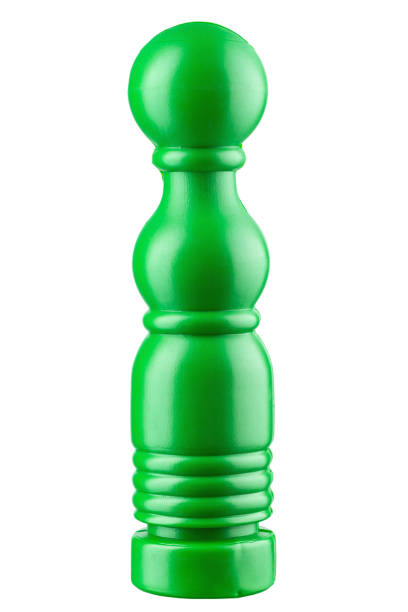 Green plastic skittles. children's toy on a white background. Bowling pins.