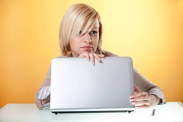 istock Thoughtful young woman with a laptop 136890209