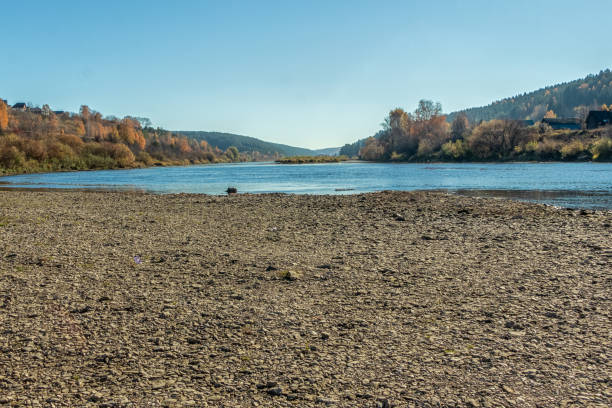 View from the stony bank of the Sylva River. Photo taken in the village of Filippovka, Kurgursky District, Perm Territory, Russia.