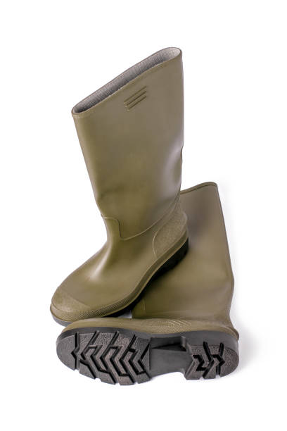 istock Green rubber boots on a white isolated background. 1368910936