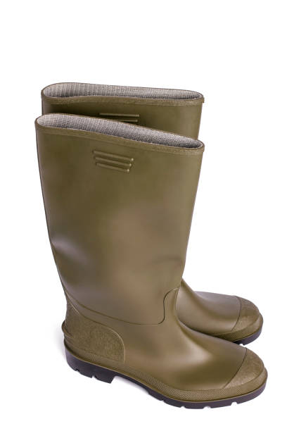 istock Green rubber boots on a white isolated background. 1368910939
