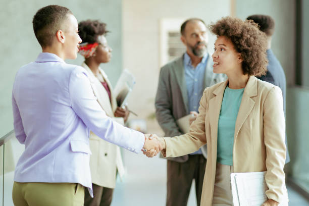 istock Businesswomen Shaking Hands 1368912975