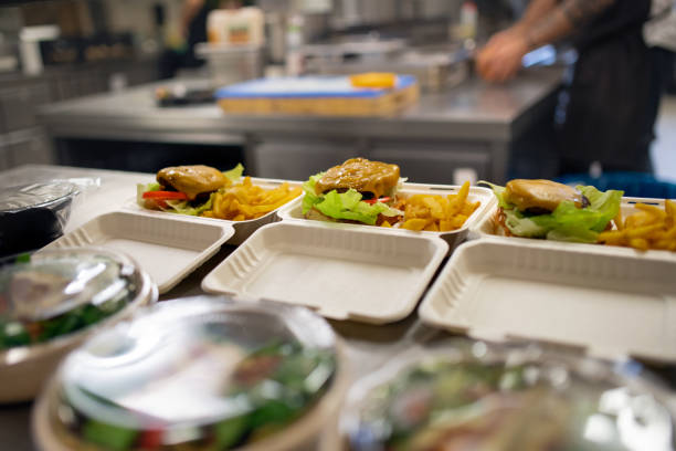 istock Meals in containers prepared for take away in kitchen restaurant. 1368915524