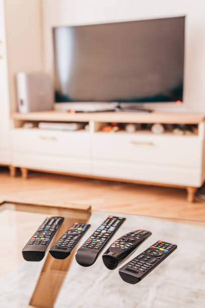 istock There are 5 remote controls on the table - remote control  without getting up from a chair 1368915913
