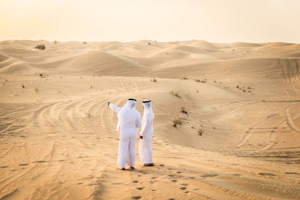istock Arabic men in the desert 1368916332