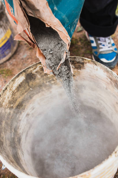 istock A professional craftsman kneads mortar in a bucket with a mixer 1368916921