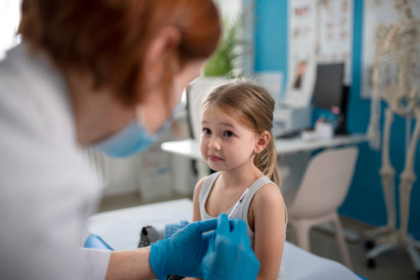istock Worried little girl getting vaccinated in doctor's office. 1368917200