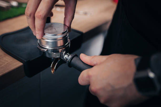 istock Barista hands during work - professional coffee brewing 1368917610