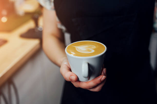istock Milk foam from a cappuccinator to create an art pattern on the top of the coffee 1368917772