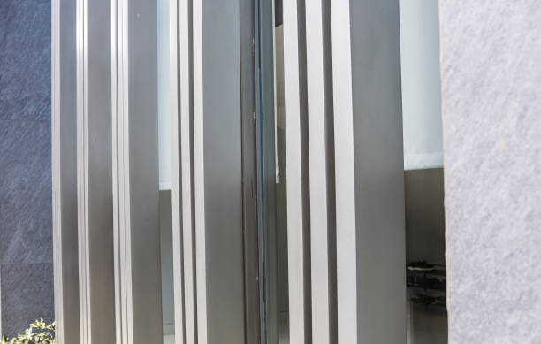 istock Vertical Extruded aluminum window frames and glass curtain wall - architectural element for the exterior design of a house. 1368918523