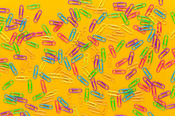 istock Paper color clip notebook on yellow background. Flat lay. 1368919294