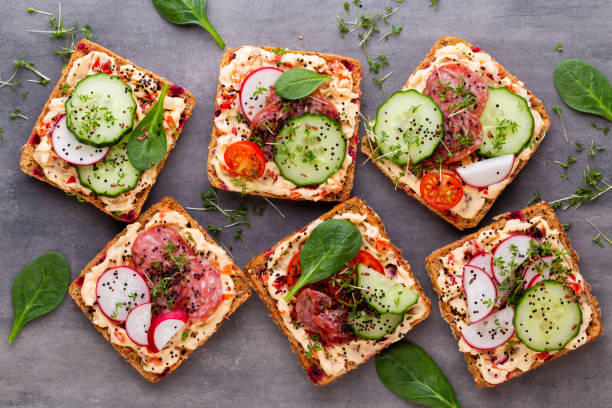 istock Sandwiches with cream cheese, vegetables and salami. 1368919332