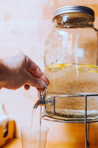 istock Refreshing refreshing vitamin lemon drink in a large glass jar 1368920043
