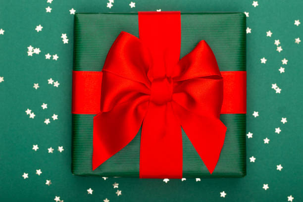 istock Christmas composition. Christmas golden glittering decorations on color background. Flat lay, top view, copy space - Image 1368920280