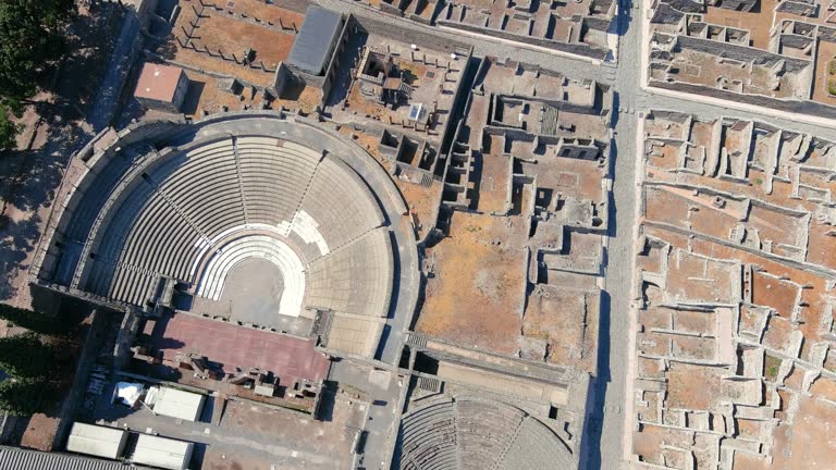 Aerial view of ruins of Pompeii, ancient Roman city destroyed by volcanic eruption of volcano Mount Vesuvius - landscape panorama of Naples from above, Campania, Italy, Europe