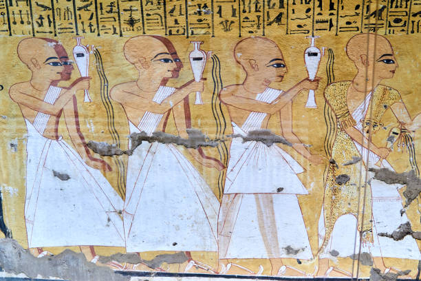A colorful mural from the tomb Inkherkhau (TT359) on the West Bank of Nile - Thebes, Luxor, Egypt, depicting a funerary procession with priests performing libations, the first wearing leopard skin