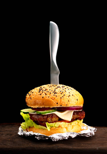 Burger hamburger fast food gourmet dinner isolated on black background