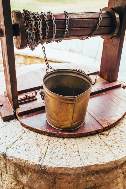 istock Metal bucket with chain on a vintage authentic well 1368924165