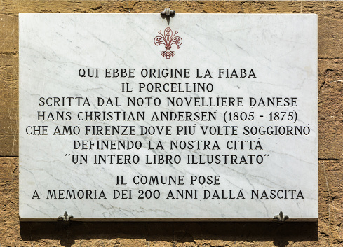Florence, Italy - MAY 10, 2019: Here originated the fairy tale the piglet written by the well-known Danish novelist Hans Christian Andersen that I love Florence where I stay several times defining our city, Memorable inscription on the wall of a building in Florence