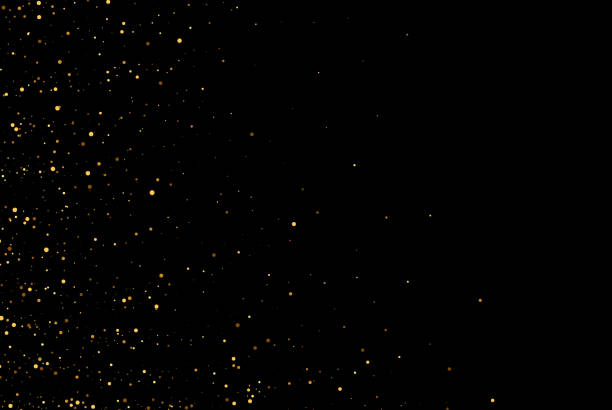 istock Gold glitter texture on black background. Golden splash of confetti. Golden grainy abstract texture on a black background. Design element. 1368926877