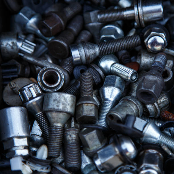 istock Metallic texture with different black or shiny screw background 1368927001