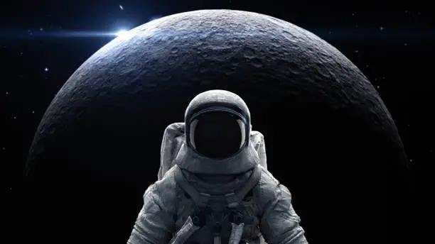 Photo of Astronaut in space suite stand in front of moon flare and sky in galaxy with 3d rendering.