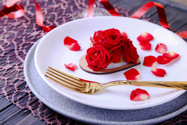 istock Valentine's Day Serving. Beautiful table setting with scarlet roses 1368928373