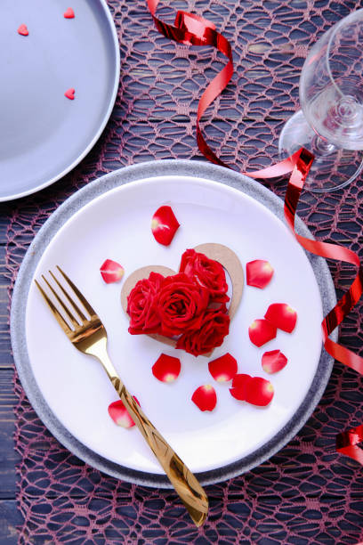 istock Valentine's Day Serving. Beautiful table setting with scarlet roses 1368929211